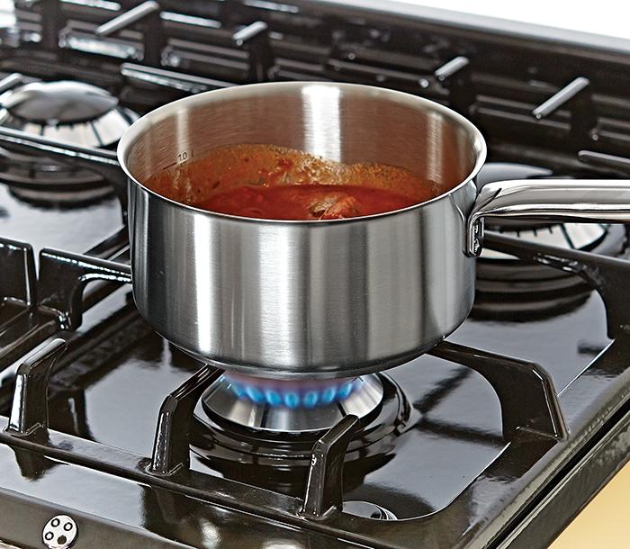 Saucepan cooking on gas burner